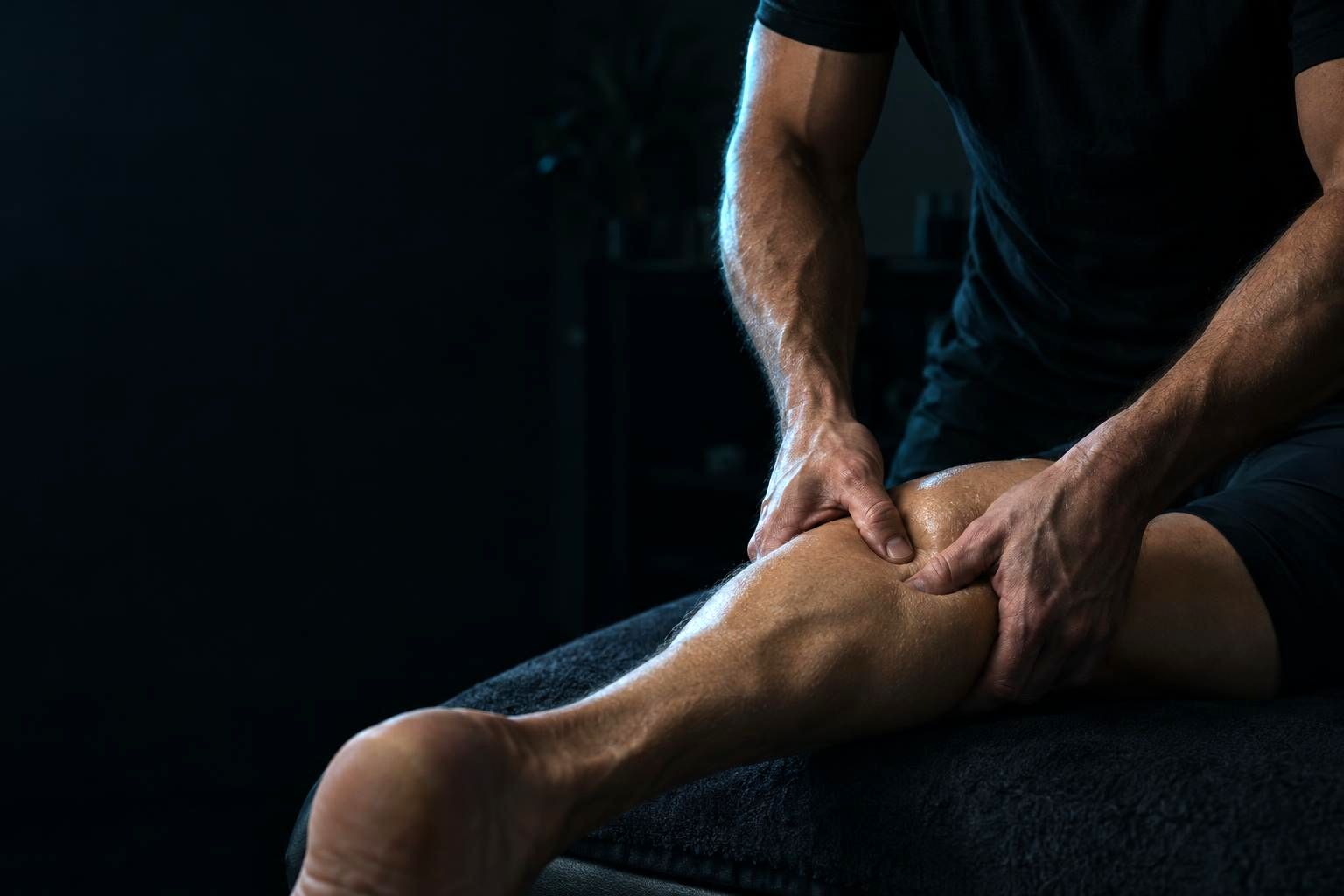 A sports massage on a runner's calf